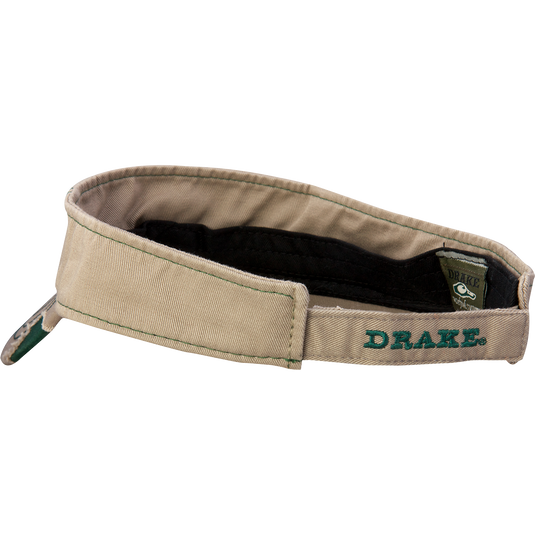 A close-up of the Drake DH Logo Visor with raised logo embroidery on the front and color-matched stitching on the bill. Velcro back closure.