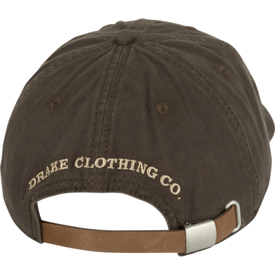 Cotton Twill Logo Cap - A low-profile brown baseball cap with a leather strap back and brass buckle. Crafted with 100% cotton twill and a contoured bill, this cap keeps you looking cool while conquering your goals.