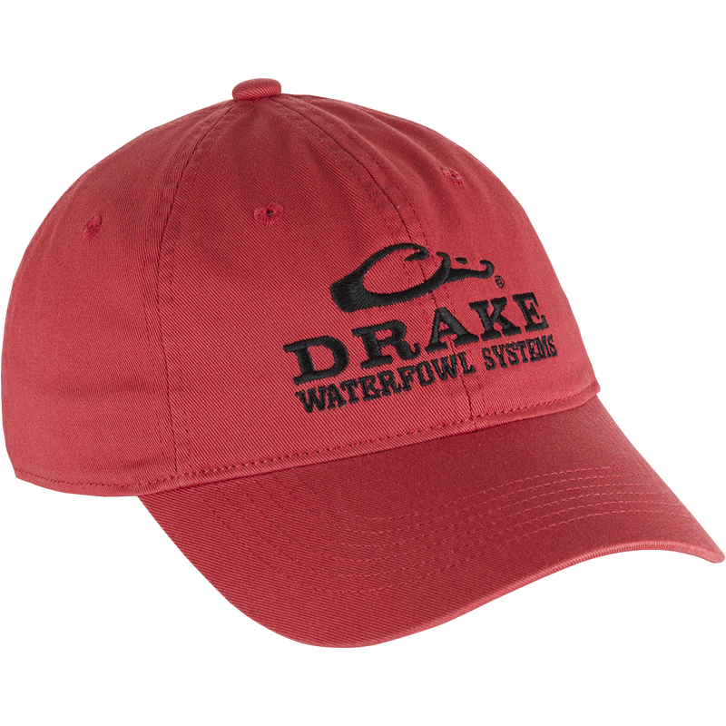 Cotton Twill Systems Cap: A low-profile red hat with black text, featuring a contoured bill and brass buckle backstrap. Stay cool and stylish with this 100% cotton twill cap.