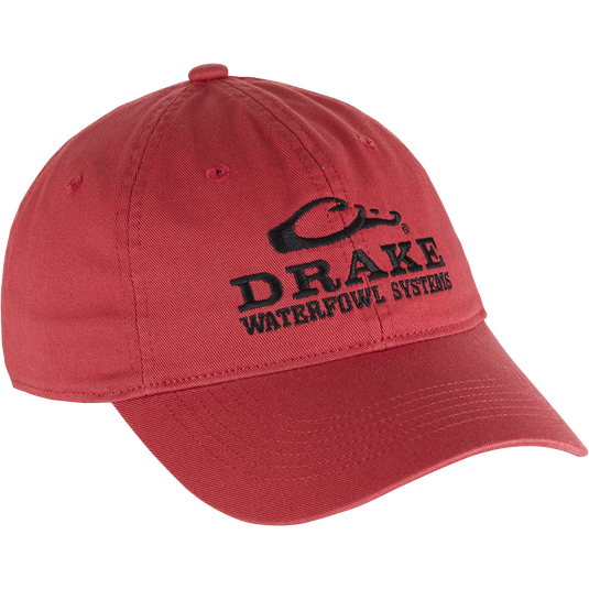 Cotton Twill Systems Cap: A low-profile red hat with black text, featuring a contoured bill and brass buckle backstrap. Stay cool and stylish with this 100% cotton twill cap.