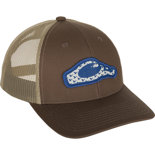 Drake 6 Panel Migrator Cap - A brown hat with a blue patch featuring a raised stitched Drake head logo of migrating ducks. Stylish, breathable, and comfortable for everyday wear.