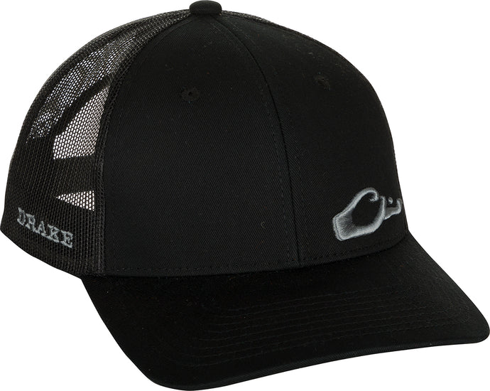 Enid Mesh Back Cap with Drake head logo in lower corner on a black hat with a hand on it. Classic trucker cap style with adjustable snapback.