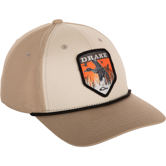 A Drake In-Flight Badge Cap featuring a duck patch on a cotton hat with a slight pre-curved visor and adjustable snapback closure.