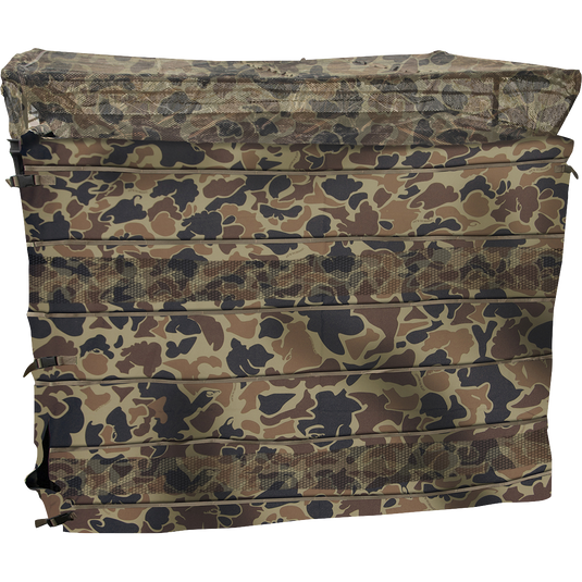 A compact camouflage-covered 3-man blind with a patent-pending No-Shadow Dual Action Top, allowing for shooting out the front or back. Equipped with brush straps and adjustable legs, it can be used on dry ground or in water. Easy to set up and break down, weighing 30 pounds. From Drake Waterfowl.
