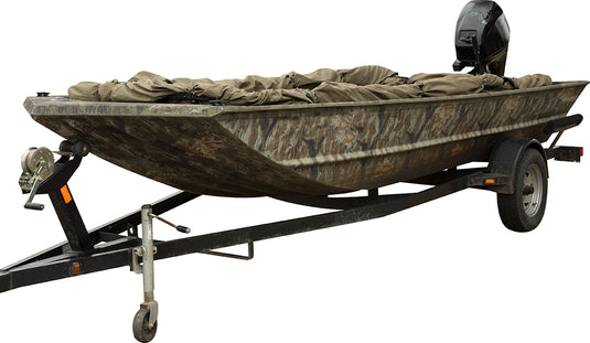 Ghillie Boat Blind with No-Shadow Dual Action Top on a trailer, providing full coverage and adjustable settings for a low-profile approach. Features include a mud motor gate, spring-loaded auto-locking legs, and easy installation. Fits boats 14' to 17' (some 18') with dimensions of 10'2" to 14'2" in length, 36" to 56" front blind width, 52" to 81" rear width, and a blind height of 42". Lightweight at 65 lbs.
