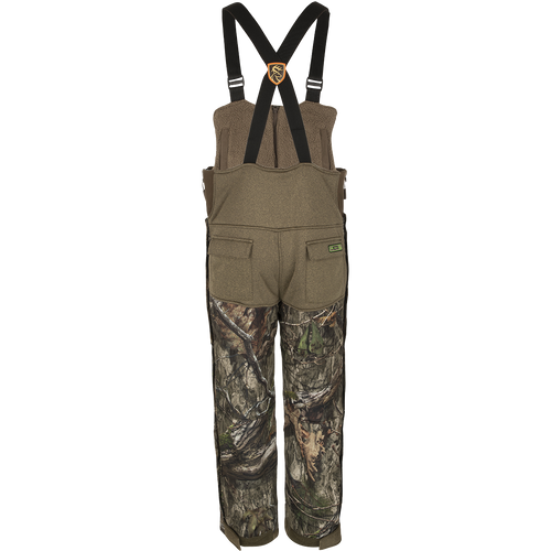 A pair of camouflage pants with Agion Active XL® scent control technology, vertical pockets with lanyards for hunting gear, and full-length side zippers for easy access.