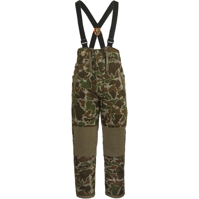 A youth silencer bib with Agion Active XL, featuring camouflage pants and suspenders.