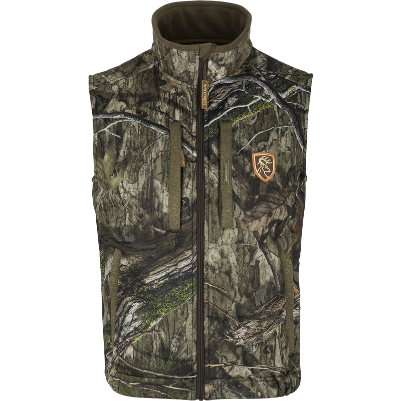 Silencer Vest with Agion Active XL, a camouflage patterned vest with logo, 100% polyester fabric, 400g fleece backing, zippered pockets.