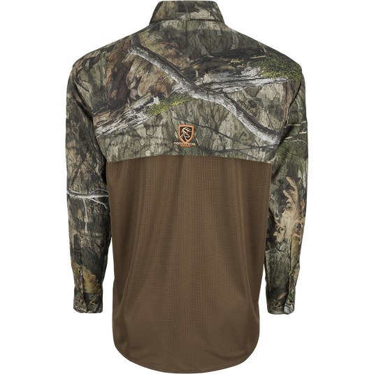 A long sleeved shirt with camouflage pattern and a logo of a deer.