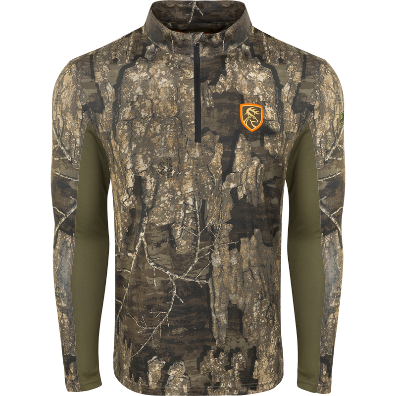 A camouflage long sleeved shirt with a logo of a deer and a close-up of green fabric.