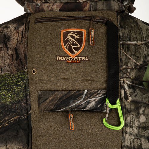 A close-up of the Stand Hunter's Silencer Jacket with Agion Active XL®. Features include scent control technology, multiple pockets, shoulder backpack straps, and a detachable hood. Perfect for late-season hunting.
