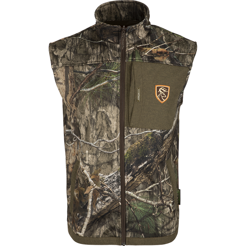 A versatile camouflage vest with a patch, perfect for hunters. Can be worn as a heavyweight jacket or midweight jacket with removable vest. Made with stretch fabric and backed by ultralight fleece. Features Agion Active XL® odor control technology.