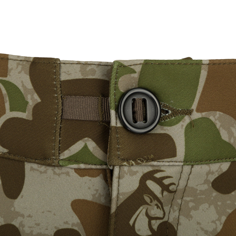 A close-up of the button on the Pursuit Tech Stretch Pant with Agion Active XL, a durable and comfortable hunting pant for cool to cold days afield. Features 4-way stretch fabric, zippered hip vents, and strategically placed zippered pockets for convenience. Ideal for early-mid season big game hunting.