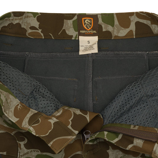 A close-up of the Pursuit Tech Stretch Pant with Agion Active XL®. Durable and comfortable, these pants are made of 100% polyester bonded fleece fabric with 4-way stretch. Features zippered pockets for easy access and zippered hip vents for heat regulation. Lightweight and perfect for early-mid season big game hunting.