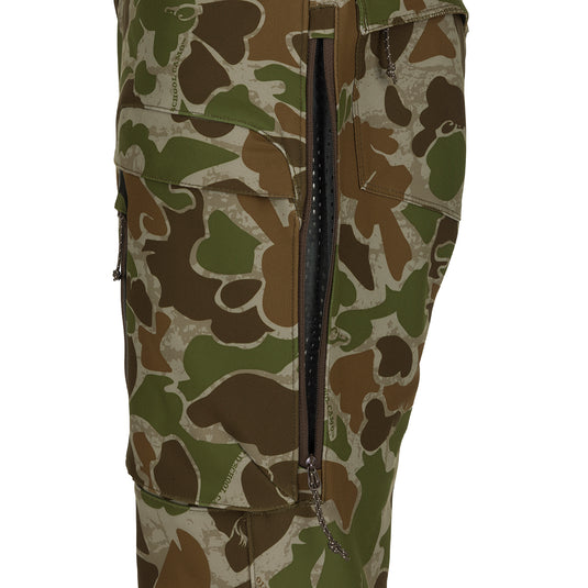 Pursuit Tech Stretch Pant with Agion Active XL®: Camouflage pants with zipper, designed for durability and comfort during cool to cold days afield. 4-way stretch fabric, zippered hip vents, and strategically placed zippered pockets for convenience. Ideal lightweight Early-Mid Season big game pant.