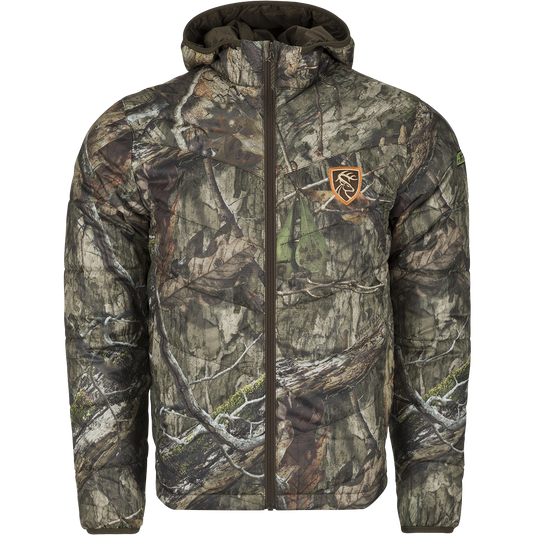 A lightweight, camouflaged jacket with a zipper, featuring synthetic down insulation and Agion Active XL® scent control technology. Ideal for cold hunts or chilly nights at camp. Can be worn as an outer layer or underneath outerwear. From Drake Waterfowl.