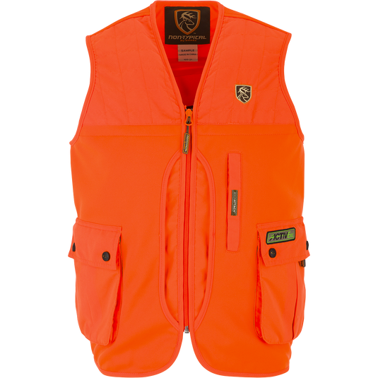 Youth Blaze Orange Vest with Agion Active XL, featuring vertical chest pockets, a front load game bag, and a large rear zippered pass-through storage pocket. Side entry fleece-lined hand warmer pockets and a logo on an orange surface.