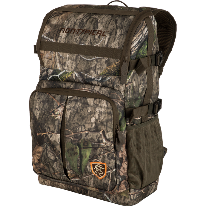 A Non-Typical Rucksack, featuring a camouflage backpack with versatile pockets, MOLLE loops, adjustable straps, and foam back padding. Perfect for hunting and outdoor adventures.
