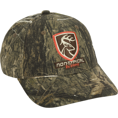 Non-Typical Logo Camo Cap with deer patch. 100% cotton twill, six-panel construction, mid-profile fit. Rear hook & loop closure.