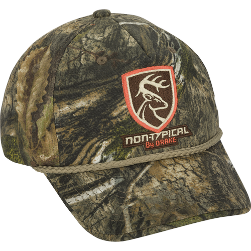 A Non-Typical 5-Panel Cap with camouflage pattern and logo. Made of 100% cotton twill fabric. Features a structured front panel and adjustable hook & loop closure. Perfect for hunting and outdoor activities.