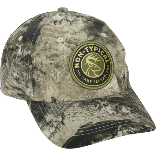 Big Game Technology Patch Camo Twill Cap: A close-up of a logo on a camo hat with a snap closure. Lightweight and comfortable, made of 60% cotton/40% polyester.