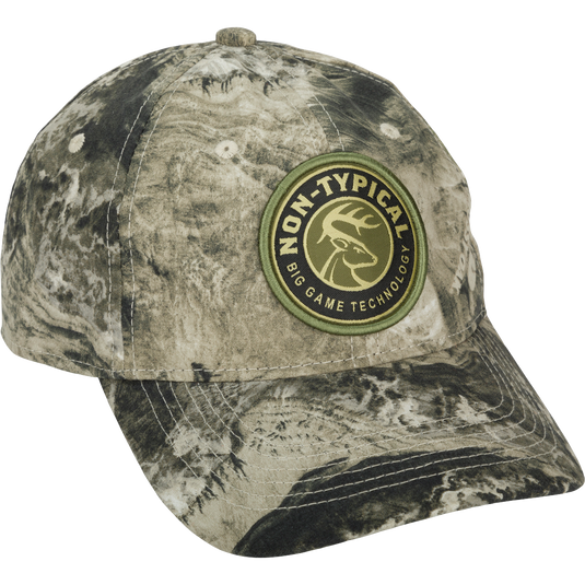 Big Game Technology Patch Camo Twill Cap: A close-up of a logo on a camo hat with a snap closure. Lightweight and comfortable, made of 60% cotton/40% polyester.
