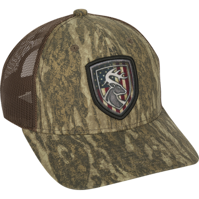 Americana Shield Patch Mesh-Back Cap with a deer flag patch on a hat. 100% cotton twill front panels with breathable mesh on the back. Rear snap closure.