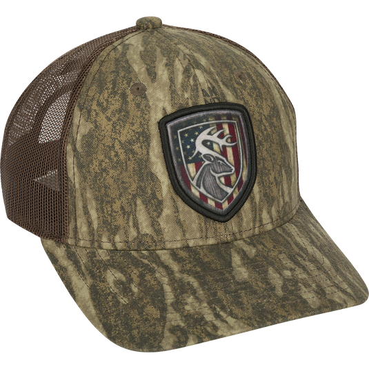 Americana Shield Patch Mesh-Back Cap with a deer flag patch on a hat. 100% cotton twill front panels with breathable mesh on the back. Rear snap closure.