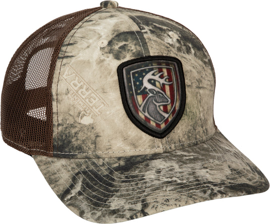 A baseball cap with a patch featuring a deer head and flag, made of cotton twill and breathable mesh. Adjustable snap closure at the back.