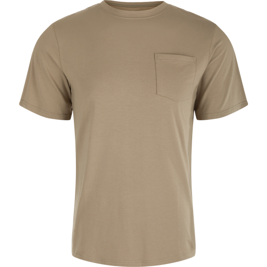 A close-up of the Bamboo Short Sleeve Pocket Crew, a tan shirt with a pocket, made from a soft and breathable bamboo blend fabric. Lightweight, moisture-wicking, and quick-drying, it offers natural odor resistance. Perfect for outdoor activities.