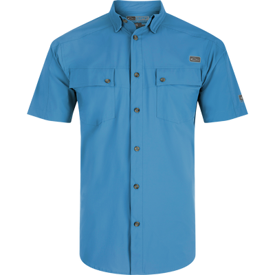 A Performance Mesh Paneled Short Sleeve Shirt with laser-punched mesh for ventilation, hidden button-down collar, and two chest pockets. Lightweight, moisture-wicking, and UPF 50 sun protection.