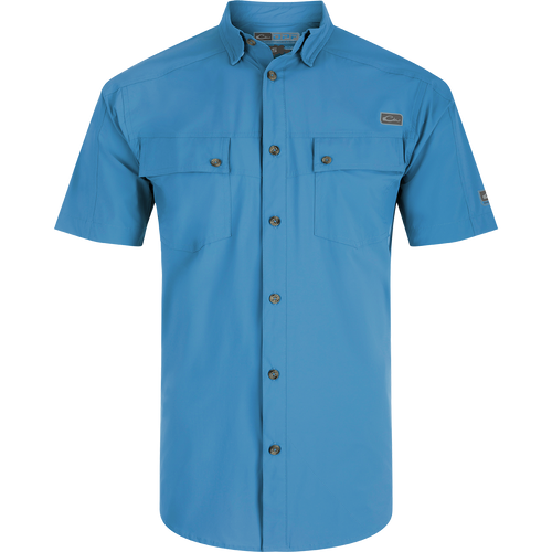 A Performance Mesh Paneled Short Sleeve Shirt with laser-punched mesh for ventilation, hidden button-down collar, and two chest pockets. Lightweight, moisture-wicking, and UPF 50 sun protection.