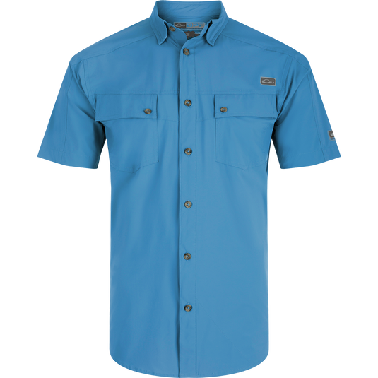 A Performance Mesh Paneled Short Sleeve Shirt with laser-punched mesh for ventilation, hidden button-down collar, and two chest pockets. Lightweight, moisture-wicking, and UPF 50 sun protection.