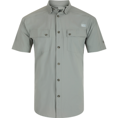 A close-up of the Performance Mesh Paneled Short Sleeve Shirt, featuring a button-down collar, laser-punched mesh back panels for ventilation, and two chest pockets. Lightweight, moisture-wicking fabric with UPF 50 sun protection.