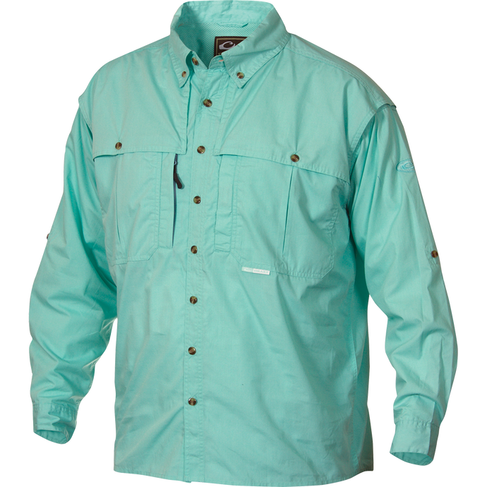 A light blue Wingshooter's shirt with buttons, made of StayCool™ cotton blend fabric. Features include front and back ventilation, oversized chest pockets, and a vertical zippered pocket. Perfect for outdoor activities or casual office wear.