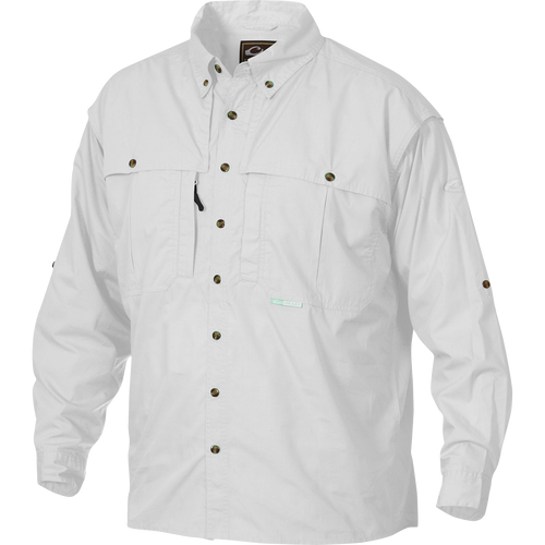 A white Wingshooter's shirt with buttons, made of StayCool™ cotton blend fabric. Features front and back ventilation, oversized chest pockets, and a vertical zippered pocket. Perfect for outdoor activities or casual office wear.