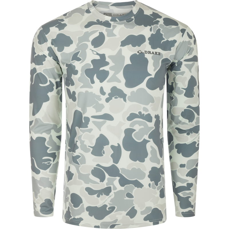 A high-performance crew shirt with a camouflage pattern, cooling fabric, UPF 50 sun protection, moisture-wicking, and quick-drying properties. Lightweight and versatile for all weather conditions. From Drake Waterfowl's collection of hunting gear and clothing.