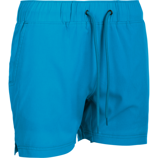 A versatile women's Commando Lined Short with a built-in liner, 4.5" inseam, and 4-way stretch. Quick drying, moisture-wicking fabric with elastic waist and drawstring. Front and back mesh pockets.