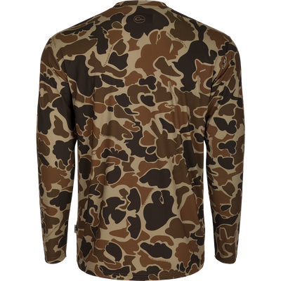 Youth Performance Crew L/S: A camouflage shirt with a logo, made of lightweight, breathable fabric. Features include cooling, moisture-wicking, and quick-drying properties. UPF 50 provides sun protection. Ideal for hunting and outdoor activities.