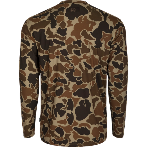 Youth Performance Crew L/S: A camouflage shirt with a logo, made of lightweight, breathable fabric. Features include cooling, moisture-wicking, and quick-drying properties. UPF 50 provides sun protection. Ideal for hunting and outdoor activities.