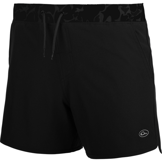 Youth Commando Lined Volley Short 5: A versatile black shorts with camo print, built-in liner, scalloped hem, and adjustable drawstring waistband.