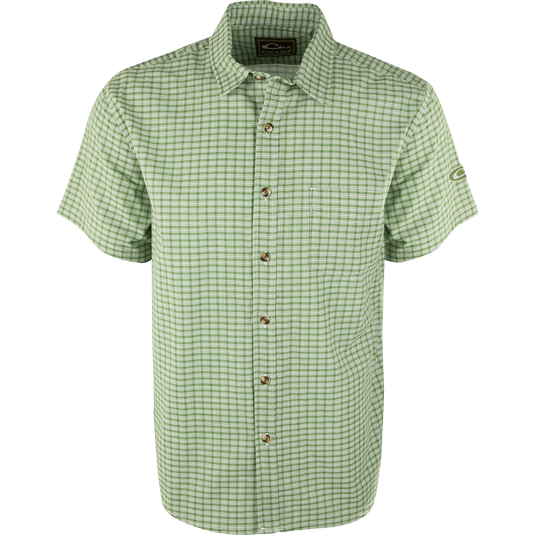 A NeverTuck Shirt S/S, green and white plaid, made of soft-washed 100% cotton. Features include an open collar style and a left chest pocket. Perfect for a comfortable and stylish look.