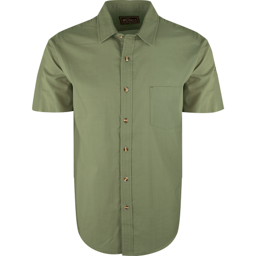 A green button-up shirt with soft-washed cotton comfort. Untucked styling and left chest pocket. Perfect for casual wear or pairing with Drake outerwear.