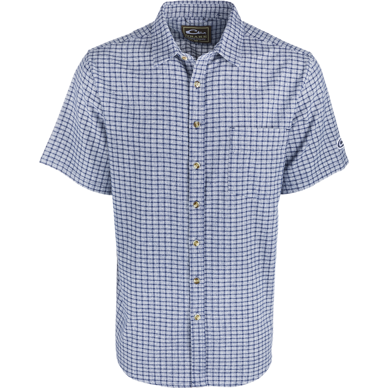 A NeverTuck Shirt S/S, blue and white checkered shirt made of soft-washed 100% cotton. Features an open collar style and left chest pocket. 
