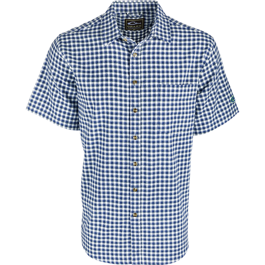 A blue and white checkered shirt with an open collar style and left chest pocket. Made of soft-washed 100% cotton for comfort and breathability.