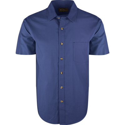 A blue NeverTuck Shirt S/S with buttons, made of soft-washed 100% cotton. Features include an open collar style and a left chest pocket. 