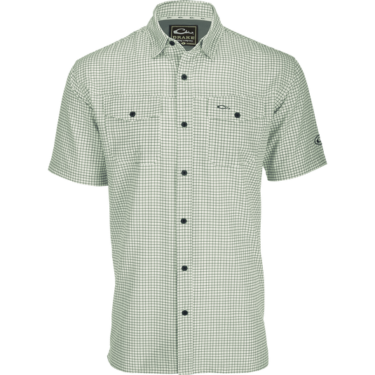 Traveler's Minigrid Short Sleeve Shirt with Four Way Stretch and split tail hem for comfort and mobility. Lightweight and wrinkle-resistant.