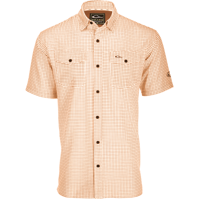 Traveler's Minigrid Short Sleeve Shirt with Four Way Stretch and split tail hem for comfort and style. Lightweight, wrinkle-resistant fabric.