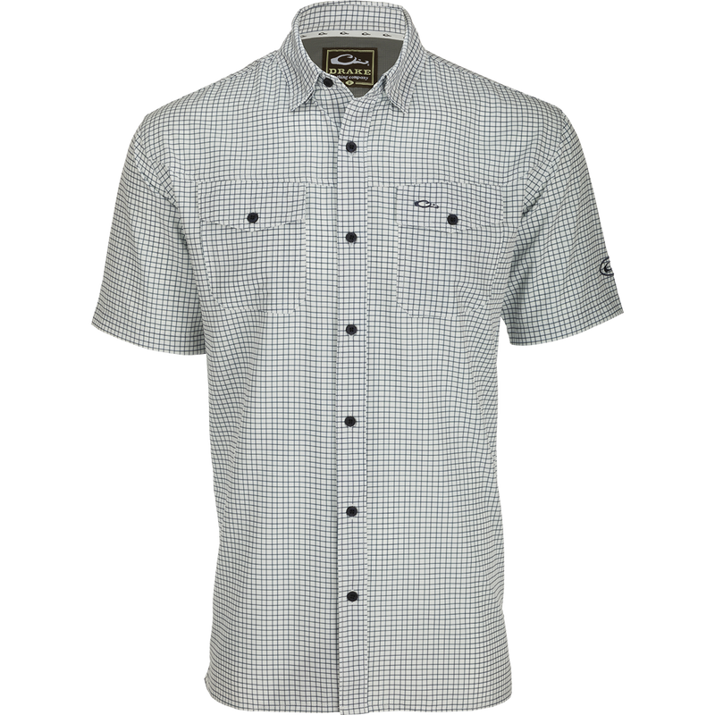 Traveler's Minigrid Short Sleeve Shirt with Four Way Stretch and split tail hem for comfort and freedom of movement. Lightweight and wrinkle-resistant.