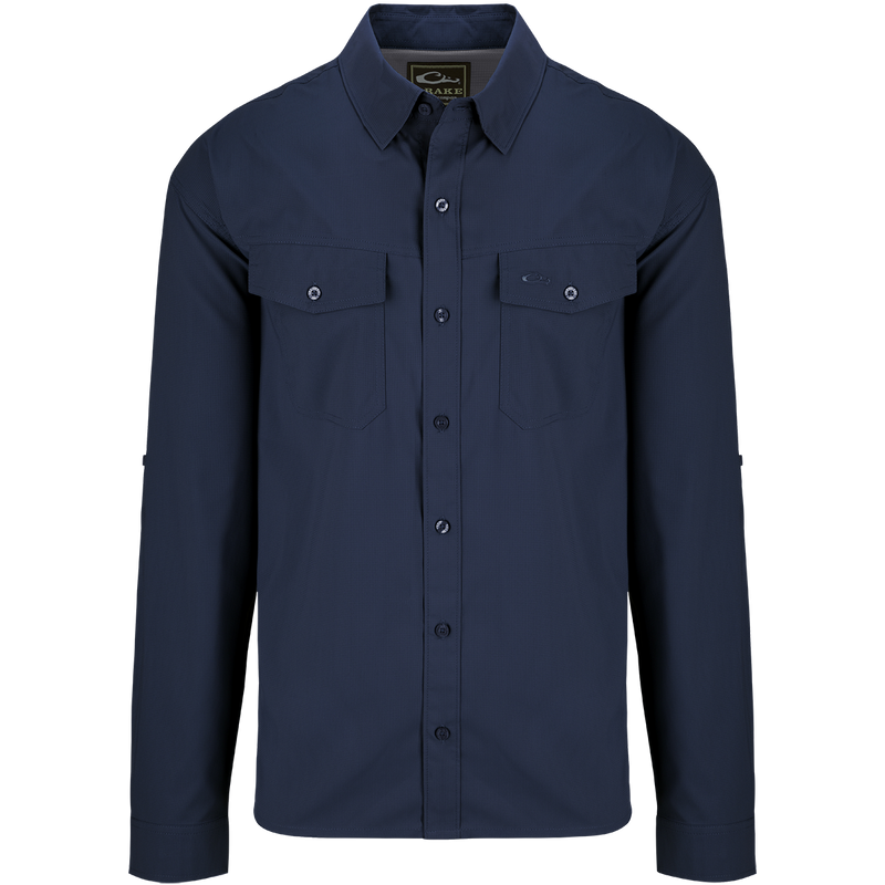 A blue dobby-textured shirt with long sleeves, hidden button-down collar, and two chest pockets. Versatile for any season.